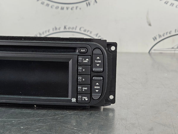 2004-07 Chrysler, Dodge, Jeep AM/FM/CD/Nav Factory Radio Assembly, 56038629AH2