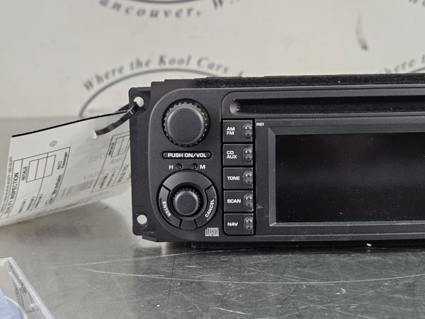 2004-07 Chrysler, Dodge, Jeep AM/FM/CD/Nav Factory Radio Assembly, 56038629AH1