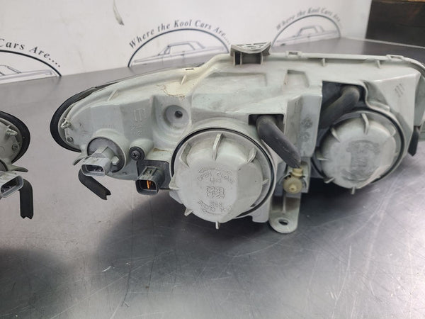2004-06 GTO Front Headlight Head Lamp Pair, Left / Right, Clear Lenses - OEM16